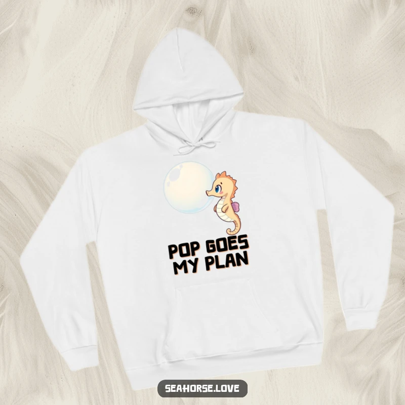 Funny hoodie depicting a seahorse with wide eyes, observing a giant bubble floating by in the deep blue sea.